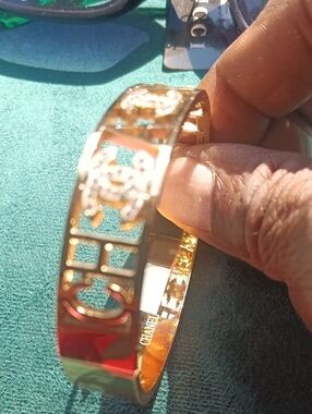 CHANEL Gold Cut-Out Logo Bangle